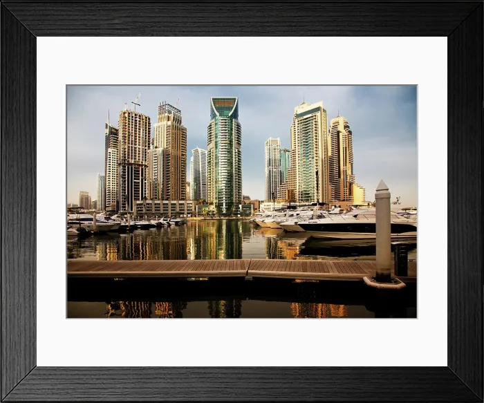 Framed Print : View of modern skyscrapers shining in sunrise lights in Dubai Marina in Dubai, United Arab Emirates Framed Print : View of modern skyscrapers shining in sunrise lights in Dubai Marina in Dubai, United Arab Emirates