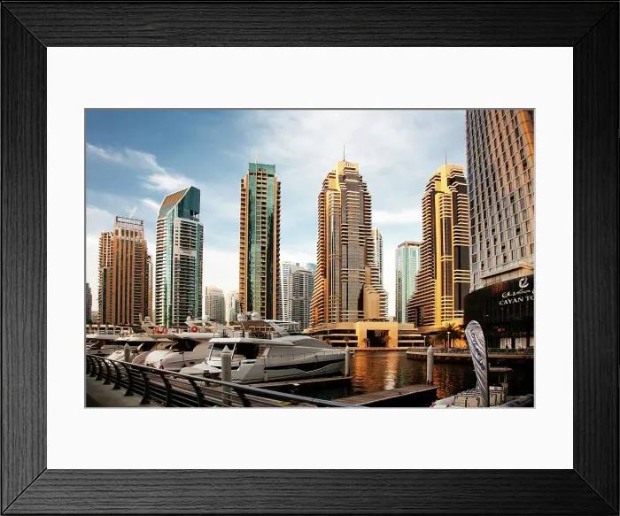 Framed Print : View of modern skyscrapers shining in sunrise lights in Dubai Marina in Dubai, United Arab Emirates Framed Print : View of modern skyscrapers shining in sunrise lights in Dubai Marina in Dubai, United Arab Emirates