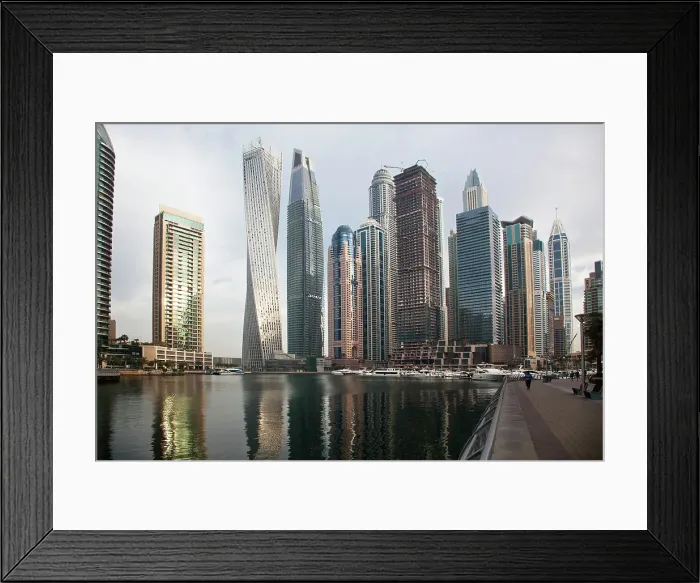 Framed Print : View of modern skyscrapers shining in sunrise lights in Dubai Marina in Dubai, United Arab Emirates Framed Print : View of modern skyscrapers shining in sunrise lights in Dubai Marina in Dubai, United Arab Emirates