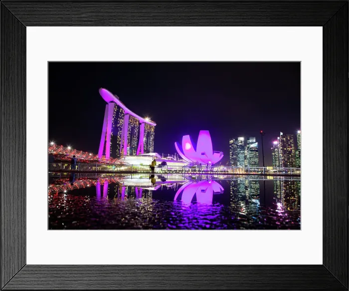 Framed Print : Skyline of Singapore Marina Bay at night with Marina Bay Sands and Art Science museum reflecting in a pond after rain, Singapore Framed Print : Skyline of Singapore Marina Bay at night with Marina Bay Sands and Art Science museum reflecting in a pond after rain, Singapore