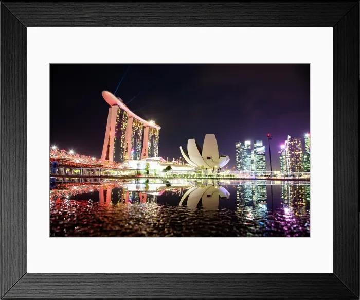 Framed Print : Skyline of Singapore Marina Bay at night with Marina Bay Sands and Art Science museum reflecting in a pond after rain, Singapore Framed Print : Skyline of Singapore Marina Bay at night with Marina Bay Sands and Art Science museum reflecting in a pond after rain, Singapore