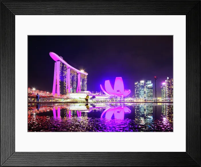 Framed Print : Skyline of Singapore Marina Bay at night with Marina Bay Sands and Art Science museum reflecting in a pond after rain, Singapore Framed Print : Skyline of Singapore Marina Bay at night with Marina Bay Sands and Art Science museum reflecting in a pond after rain, Singapore