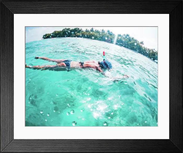 Framed Print : Woman snorkeling in clear tropical sea, The Maldives, Indian Ocean Framed Print : Woman snorkeling in clear tropical sea, The Maldives, Indian Ocean