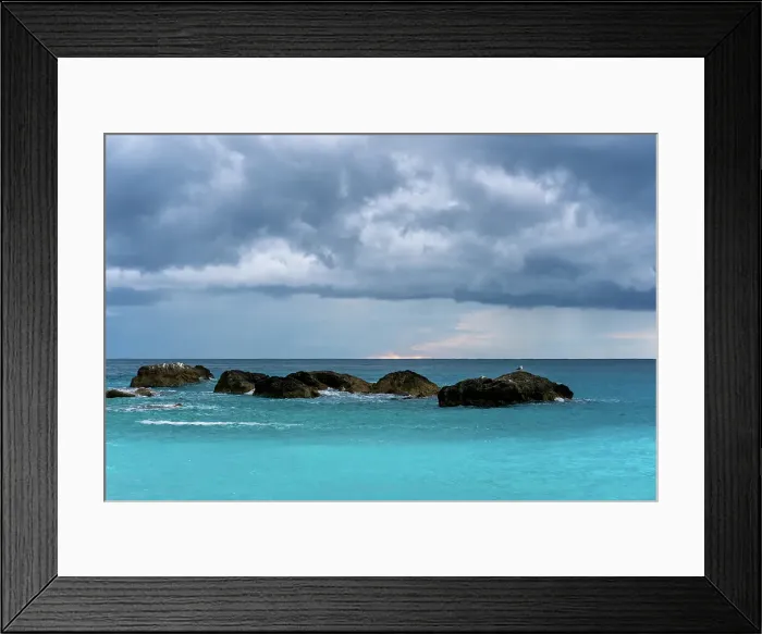 Framed Print : Seagulls on top of rocks on a stormy day above turquoise sea, Greece Framed Print : Seagulls on top of rocks on a stormy day above turquoise sea, Greece