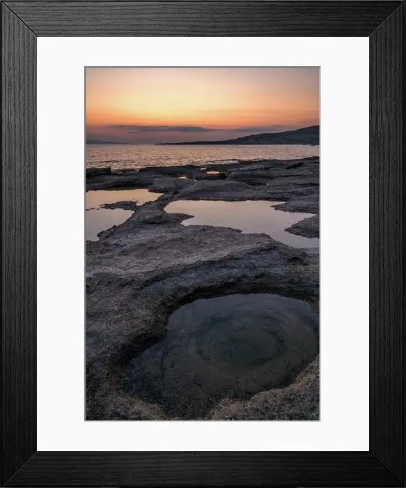 Framed Print : Natural holes in the rocks full of water at sunset, with sea in the background, Greece Framed Print : Natural holes in the rocks full of water at sunset, with sea in the background, Greece