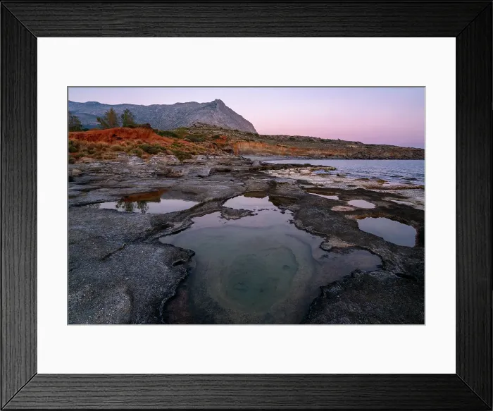 Framed Print : Aspes beach, natural holes in the rocks full of water at sunset, with sea in the background, Greece Framed Print : Aspes beach, natural holes in the rocks full of water at sunset, with sea in the background, Greece