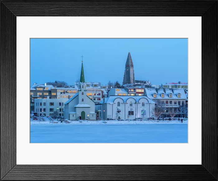 Framed Print : View of the Hallgrimskirkja Church and city skyline of Reykjavik from Tjornin lake at sunset in winter, Reykjavik, Iceland