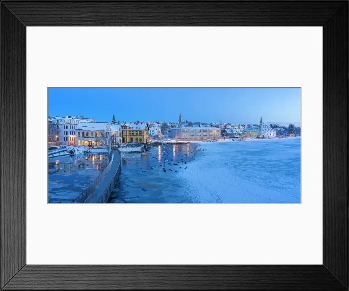Framed Print : View of waterfront buildings and city skyline in background in the city centre of Reykjavik at dusk in winter, Reykjavik, Iceland Framed Print : View of waterfront buildings and city skyline in background in the city centre of Reykjavik at dusk in winter, Reykjavik, Iceland