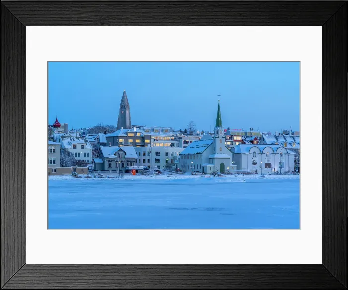 Framed Print : View of the Hallgrimskirkja Church and city skyline of Reykjavik from Tjornin lake at sunset in winter, Reykjavik, Iceland