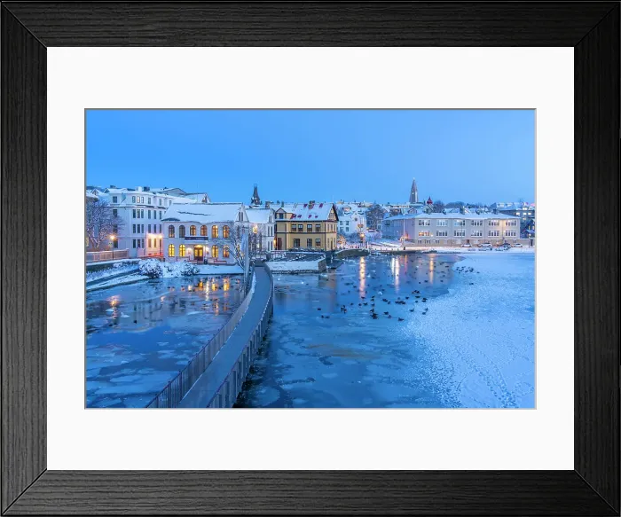 Framed Print : View of waterfront buildings and city skyline in background in the city centre of Reykjavik at dusk in winter, Reykjavik, Iceland Framed Print : View of waterfront buildings and city skyline in background in the city centre of Reykjavik at dusk in winter, Reykjavik, Iceland