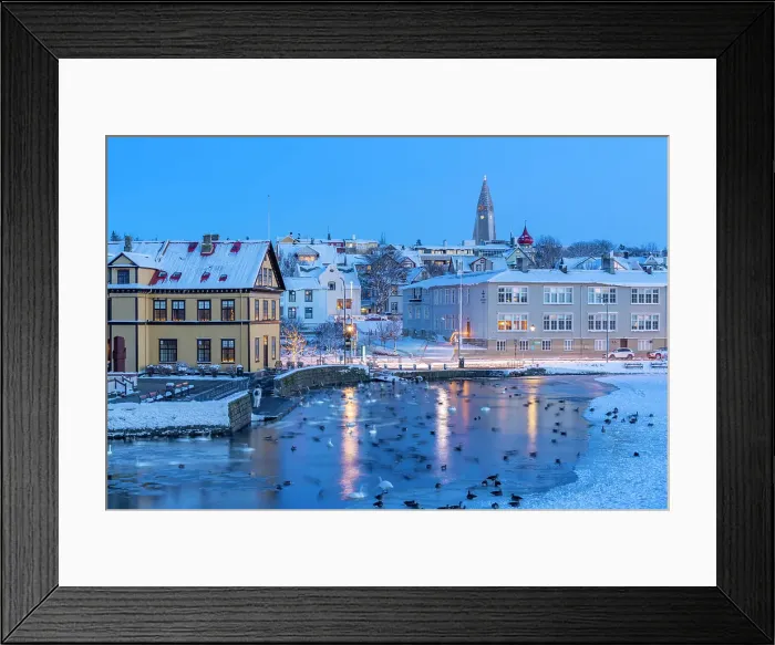 Framed Print : View of waterfront buildings and city skyline in background in the city centre of Reykjavik at dusk in winter, Reykjavik, Iceland Framed Print : View of waterfront buildings and city skyline in background in the city centre of Reykjavik at dusk in winter, Reykjavik, Iceland