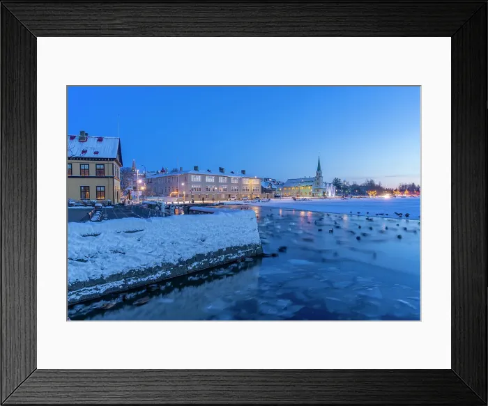 Framed Print : View of swans and ducks with Lutheran Free Church in background in the city centre of Reykjavik at dusk in winter, Reykjavik, Iceland Framed Print : View of swans and ducks with Lutheran Free Church in background in the city centre of Reykjavik at dusk in winter, Reykjavik, Iceland