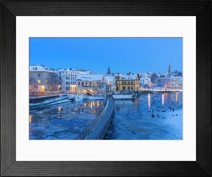 Framed Print : View of waterfront buildings and city skyline in background in the city centre of Reykjavik at dusk in winter, Reykjavik, Iceland Framed Print : View of waterfront buildings and city skyline in background in the city centre of Reykjavik at dusk in winter, Reykjavik, Iceland