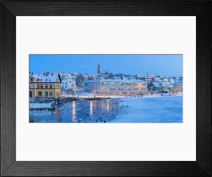 Framed Print : View of waterfront buildings and city skyline in background in the city centre of Reykjavik at dusk in winter, Reykjavik, Iceland Framed Print : View of waterfront buildings and city skyline in background in the city centre of Reykjavik at dusk in winter, Reykjavik, Iceland