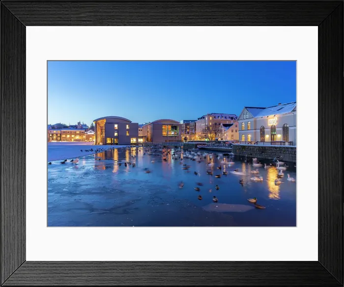 Framed Print : View of waterfront buildings and City Hall in background in the city centre of Reykjavik at dusk in winter, Reykjavik, Iceland Framed Print : View of waterfront buildings and City Hall in background in the city centre of Reykjavik at dusk in winter, Reykjavik, Iceland