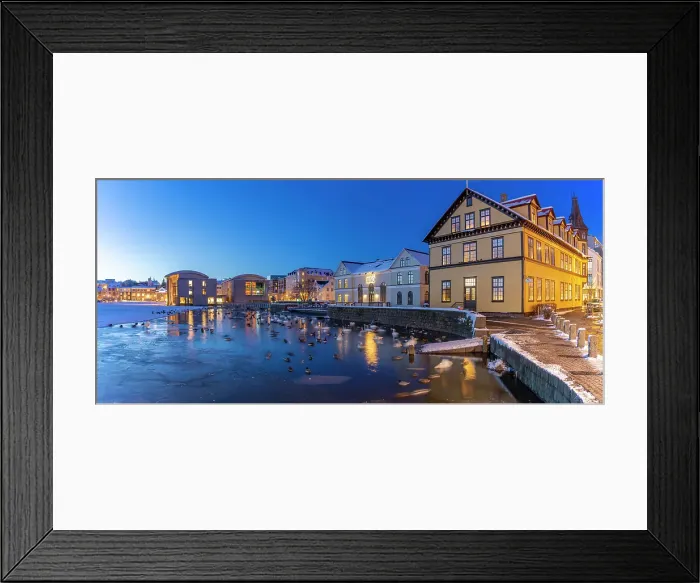 Framed Print : View of waterfront buildings and City Hall in background in the city centre of Reykjavik at dusk in winter, Reykjavik, Iceland Framed Print : View of waterfront buildings and City Hall in background in the city centre of Reykjavik at dusk in winter, Reykjavik, Iceland