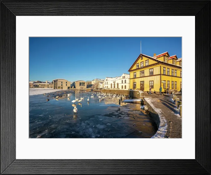 Framed Print : View of waterfront buildings and Tjornin lake on a sunny day in winter, Reykjavik, Iceland Framed Print : View of waterfront buildings and Tjornin lake on a sunny day in winter, Reykjavik, Iceland
