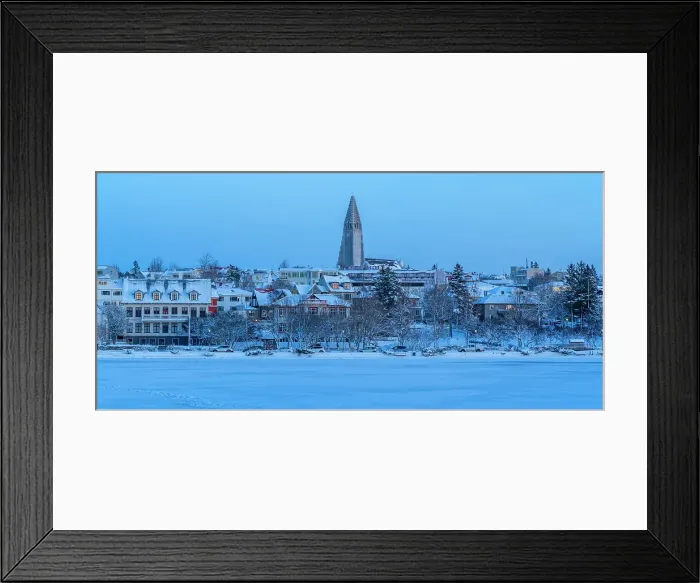 Framed Print : View of the Hallgrimskirkja Church and city skyline of Reykjavik from Tjornin lake at sunset in winter, Reykjavik, Iceland
