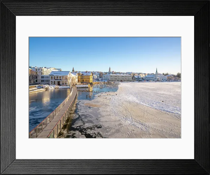 Framed Print : View of Tjornin lake and city skyline on a sunny day in winter, Reykjavik, Iceland Framed Print : View of Tjornin lake and city skyline on a sunny day in winter, Reykjavik, Iceland