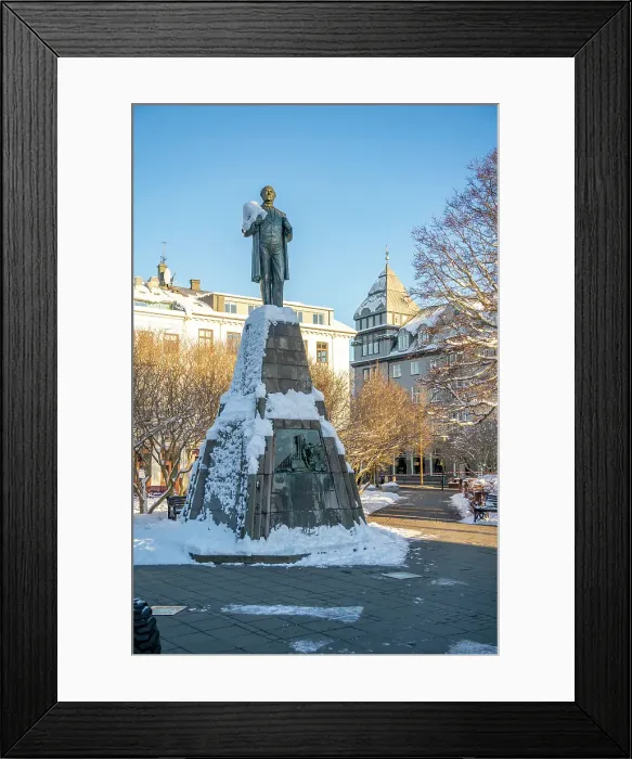 Framed Print : View of Brautryojandinn statue in Austurvollur park and gardens on a sunny day in winter, Reykjavik, Iceland