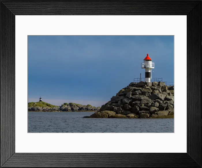 Framed Print : Lighthouse on the breakwall leading to the picturesque Norwegian fishing town of Reine, Lofoten Island Group, Norway Framed Print : Lighthouse on the breakwall leading to the picturesque Norwegian fishing town of Reine, Lofoten Island Group, Norway