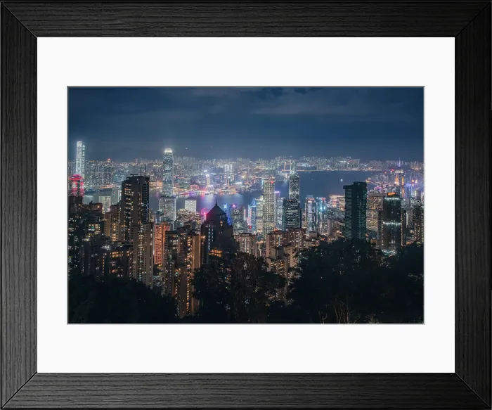 Framed Print : The Hong Kong Skyline from the Peak with the lights of Hong Kong, China Framed Print : The Hong Kong Skyline from the Peak with the lights of Hong Kong, China