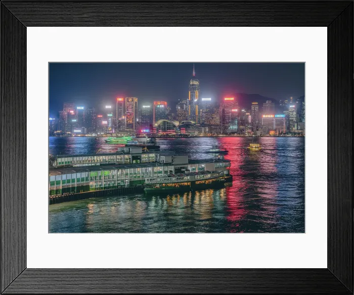 Framed Print : The Hong Kong Skyline at night with the Star Ferry terminal in the foreground, Hong Kong, China Framed Print : The Hong Kong Skyline at night with the Star Ferry terminal in the foreground, Hong Kong, China