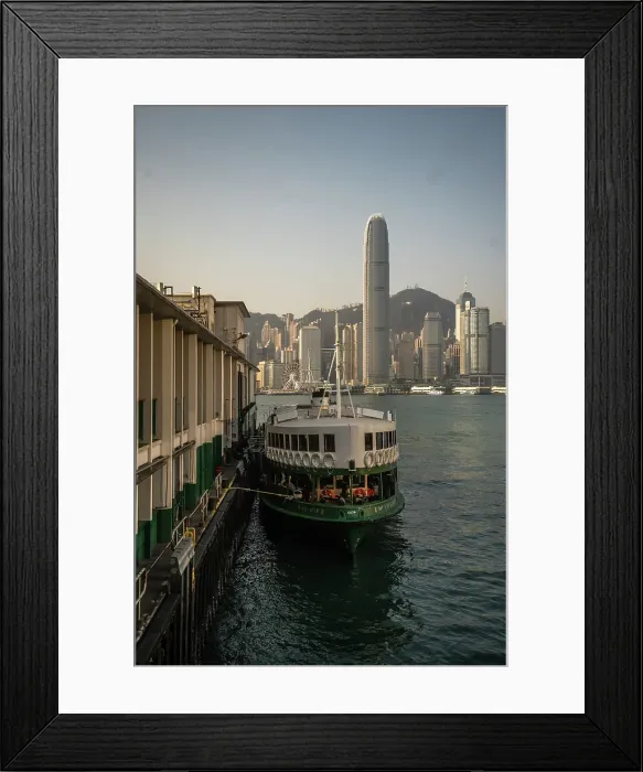 Framed Print : A vertical image of a docked Star ferry with Hong Kong Skyline in the background, Hong Kong, China Framed Print : A vertical image of a docked Star ferry with Hong Kong Skyline in the background, Hong Kong, China