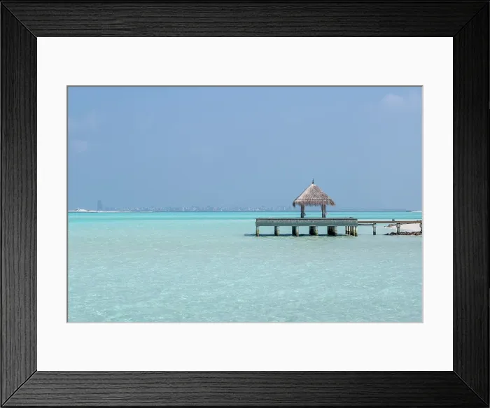 Framed Print : Pier and the clear waters of the lagoon on an exotic Island in The Maldives, Indian Ocean Framed Print : Pier and the clear waters of the lagoon on an exotic Island in The Maldives, Indian Ocean