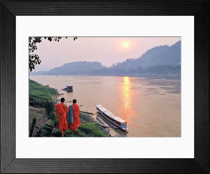 Framed Print : Monks at sunset on Mekong River at Luang Prabang, Laos Framed Print : Monks at sunset on Mekong River at Luang Prabang, Laos