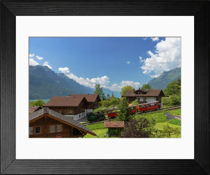 Framed Print : Brienz Rothorn train passing traditional chalets, Brienz, Bernese Oberland, Switzerland Framed Print : Brienz Rothorn train passing traditional chalets, Brienz, Bernese Oberland, Switzerland