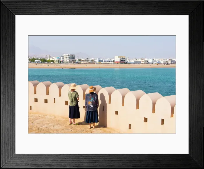 Framed Print : Two female tourists by crenelated wall of lighthouse, Al Ayjah village, Sur, capital of Ash Sharqiyah Region, Sultanate of Oman, Arabian Peninsula Framed Print : Two female tourists by crenelated wall of lighthouse, Al Ayjah village, Sur, capital of Ash Sharqiyah Region, Sultanate of Oman, Arabian Peninsula