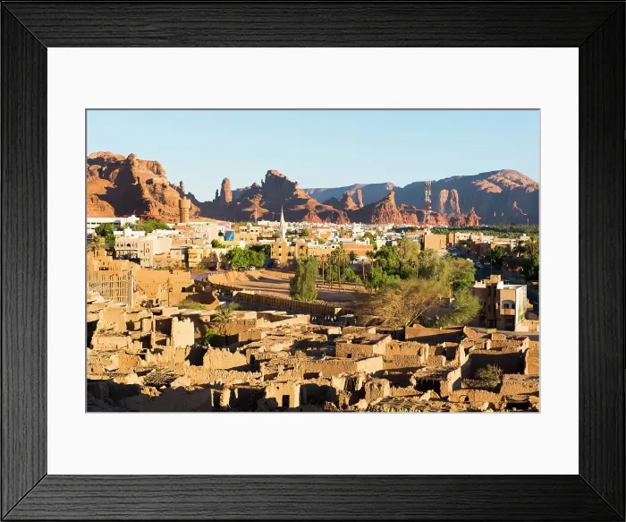 Framed Print : Old mudbrick village under reconstruction with new neighborhoods in the background, in the Old town of AlUla, Medina Province, Saudi Arabia Framed Print : Old mudbrick village under reconstruction with new neighborhoods in the background, in the Old town of AlUla, Medina Province, Saudi Arabia
