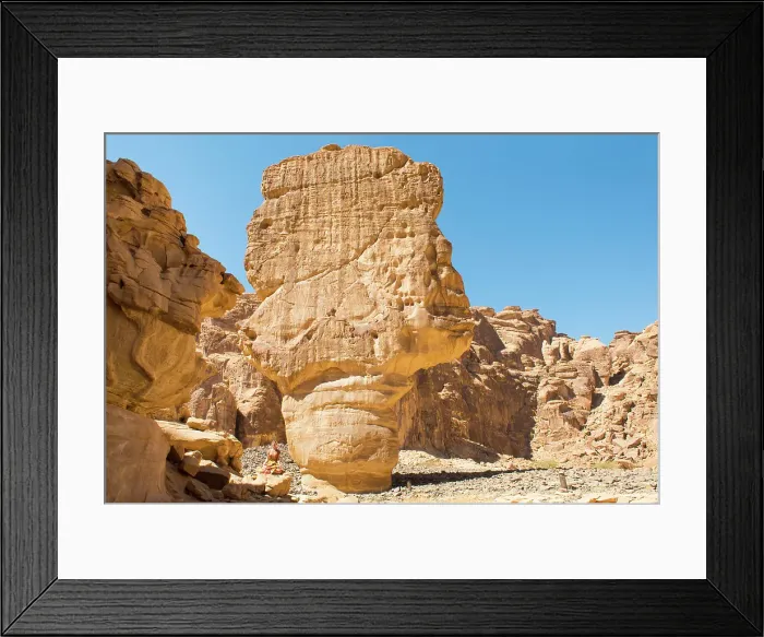 Framed Print : Woman practising yoga poses among sandstone rock formation in the desert canyons of the Ashar Valley, Medina Province, Saudi Arabia Framed Print : Woman practising yoga poses among sandstone rock formation in the desert canyons of the Ashar Valley, Medina Province, Saudi Arabia
