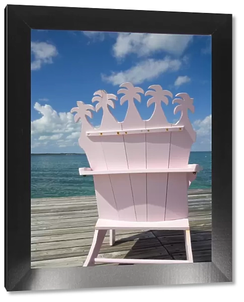 Wooden pink beach chairs in shape of palm trees