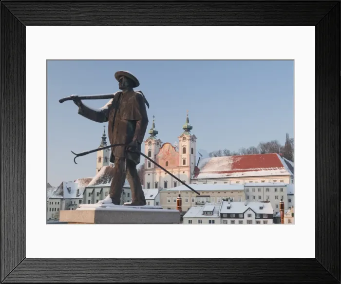 Framed Print : Statue honouring townspeople and Baroque Michaelerkirche church dating from 1635 at sunset