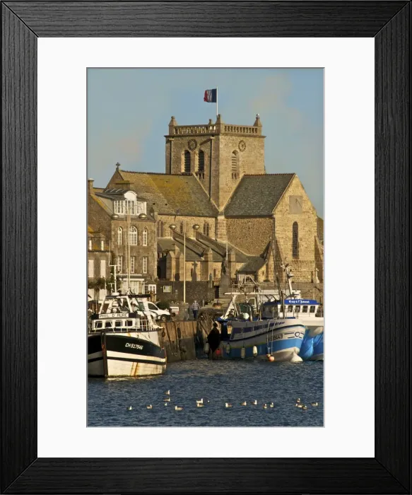 Framed Print : Harbour and fishing boats with houses and church in the background, Barfleur Framed Print : Harbour and fishing boats with houses and church in the background, Barfleur
