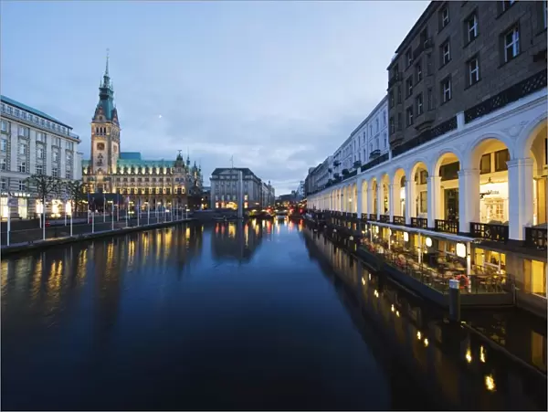 Rathaus (City Hall) illuminated at night reflected in a canal, Hamburg, Germany, Europe
