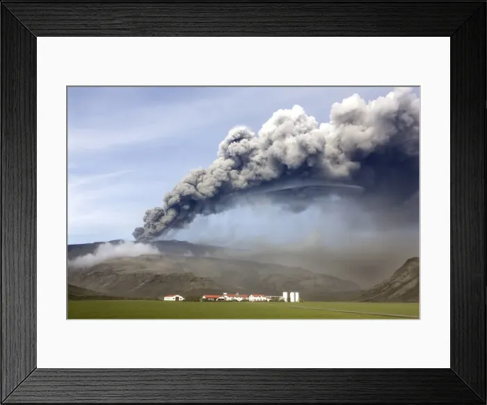 Framed Print : Farm buildings and green fields with the ash plume of the Eyjafjallajokull eruption in the distance Framed Print : Farm buildings and green fields with the ash plume of the Eyjafjallajokull eruption in the distance