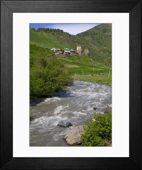 Framed Print : Little river running below a fortified mountain village, Svanetia, Georgia Framed Print : Little river running below a fortified mountain village, Svanetia, Georgia
