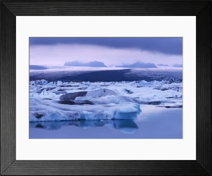 Framed Print : Jokulsarlon glacial lagoon beneath Breidarmerkurjokull (Vatnajokull) glacier which feeds it