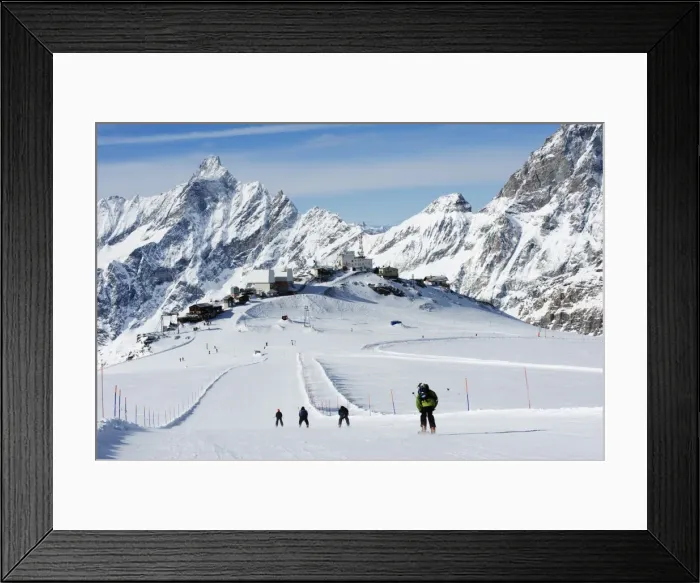 Framed Print : Skiers skiing on a ski run, mountain scenery in Cervinia ski resort, Cervinia Framed Print : Skiers skiing on a ski run, mountain scenery in Cervinia ski resort, Cervinia