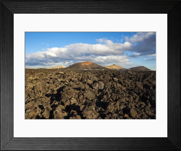 Framed Print : Irregular blocky lava (Hawaiian term: a a) and cinder cones of the volcanic landscape of Timanfaya National Park, Lanzarote, Canary Islands, Spain, Atlantic Framed Print : Irregular blocky lava (Hawaiian term: a a) and cinder cones of the volcanic landscape of Timanfaya National Park, Lanzarote, Canary Islands, Spain, Atlantic