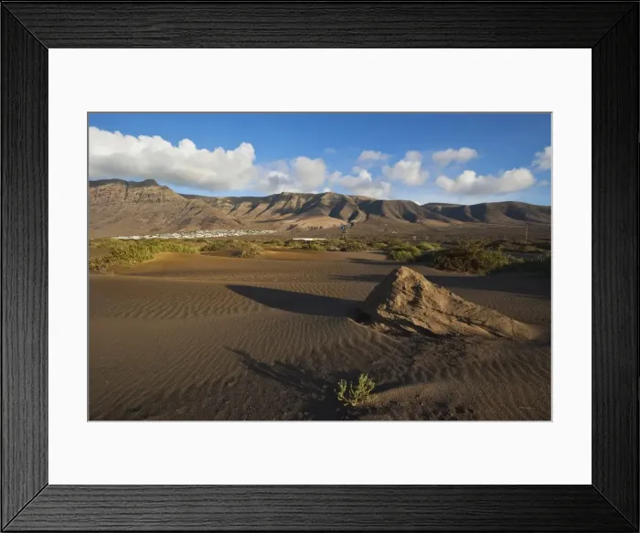 Framed Print : Volcanic cliffs rising to 600m over desert landscape near Famara, with its low-rise bungalow development, Famara, Lanzarote, Canary Islands, Spain, Atlantic Framed Print : Volcanic cliffs rising to 600m over desert landscape near Famara, with its low-rise bungalow development, Famara, Lanzarote, Canary Islands, Spain, Atlantic