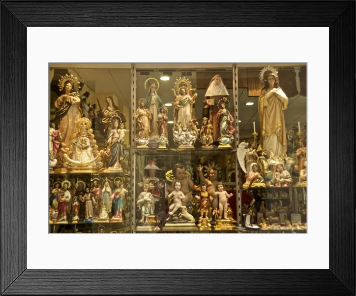 Framed Print : Shop window of a religious articles shop with virgins, angels, and Christ for sale Framed Print : Shop window of a religious articles shop with virgins, angels, and Christ for sale