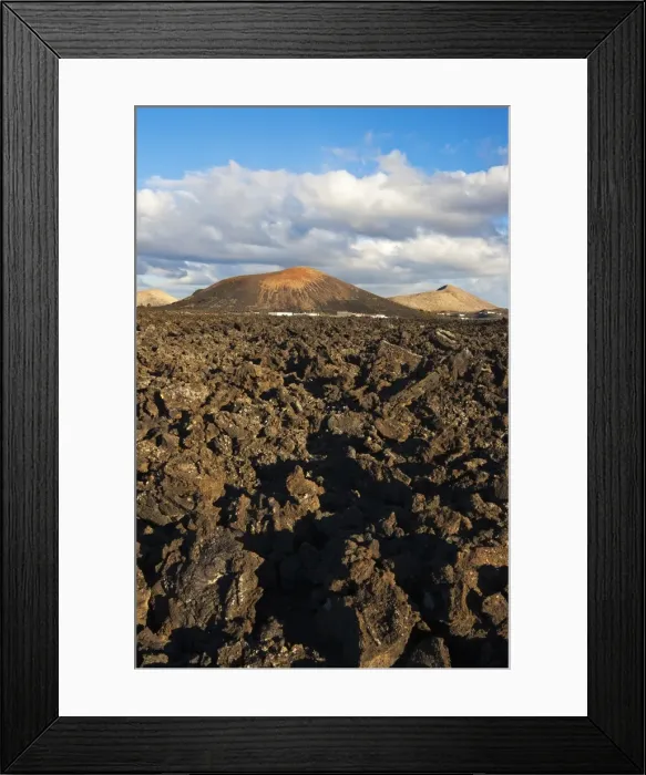 Framed Print : Irregular blocky lava (a a) and cinder cones of the volcanic landscape of Timanfaya National Park, Lanzarote, Canary Islands, Spain, Atlantic Framed Print : Irregular blocky lava (a a) and cinder cones of the volcanic landscape of Timanfaya National Park, Lanzarote, Canary Islands, Spain, Atlantic