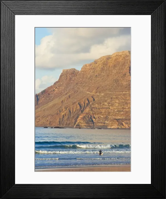 Framed Print : Spectacular 600m volcanic cliffs of the Risco de Famara rising over Lanzarotes finest surf beach at Famara in the north west of the island, Famara, Lanzarote, Canary Islands, Spain, Atlantic Framed Print : Spectacular 600m volcanic cliffs of the Risco de Famara rising over Lanzarotes finest surf beach at Famara in the north west of the island, Famara, Lanzarote, Canary Islands, Spain, Atlantic