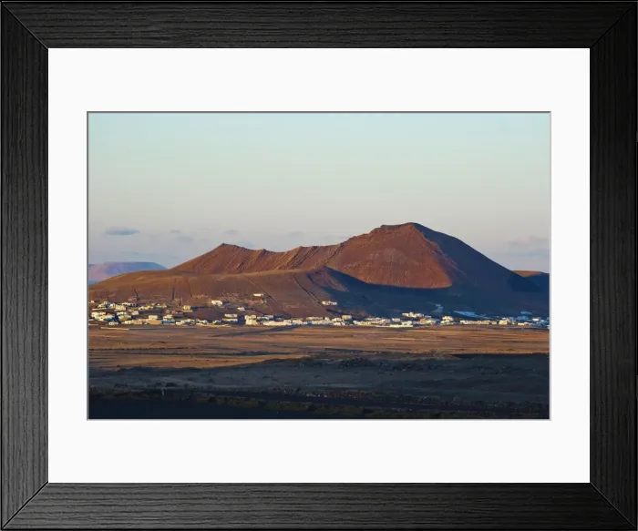 Framed Print : Volcanic cinder cones and the town of Soo at sunset in the mid north of the island