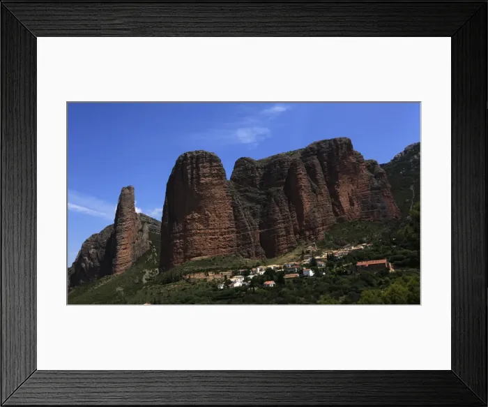 Framed Print : The small village of Riglos below huge conglomerate towers rising over a thousand feet above the plains near Heusca and Jaca, northern Aragon, southern Pyrenees region Framed Print : The small village of Riglos below huge conglomerate towers rising over a thousand feet above the plains near Heusca and Jaca, northern Aragon, southern Pyrenees region