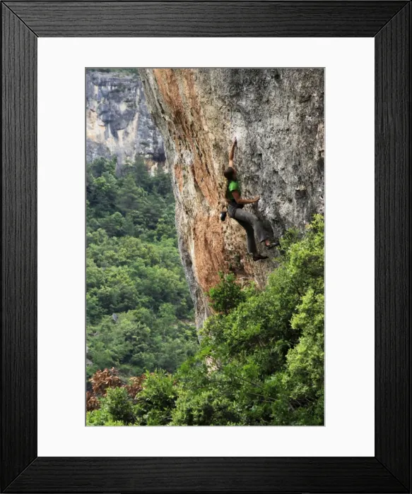 Framed Print : A woman tackles a very difficult climb on limestone cliffs near Siuarana Framed Print : A woman tackles a very difficult climb on limestone cliffs near Siuarana